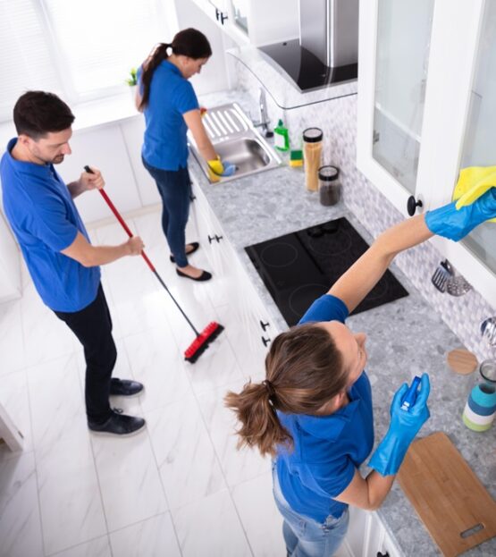 Janitors Cleaning Kitchen